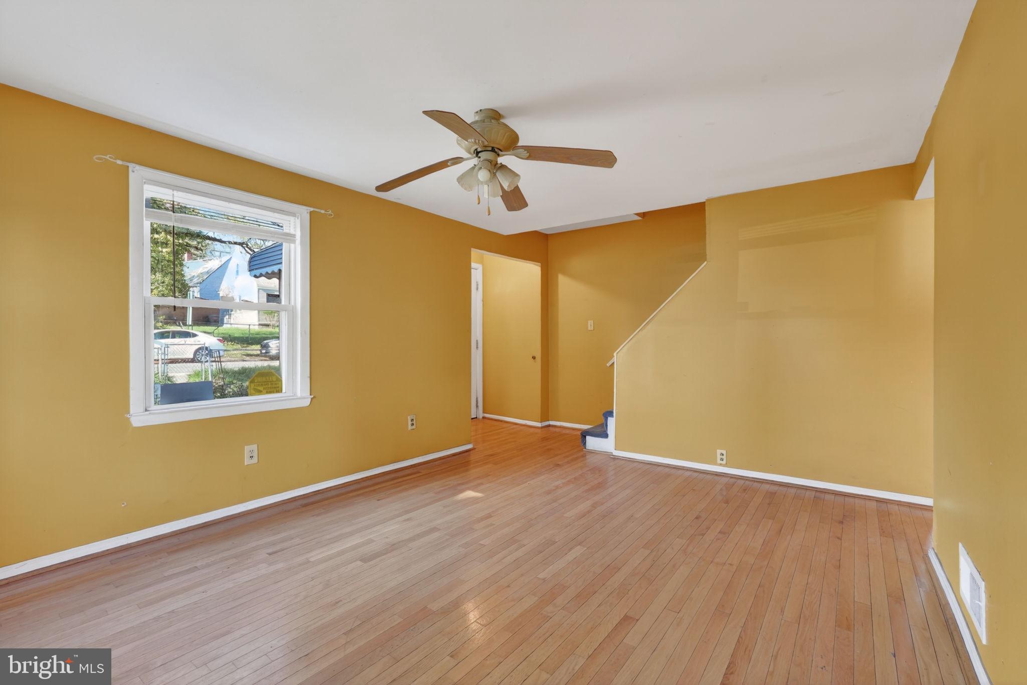5441 Taussig Road Bladensburg, MD 20710 - Photo 7 of 37 a view of empty room with wooden floor and fan