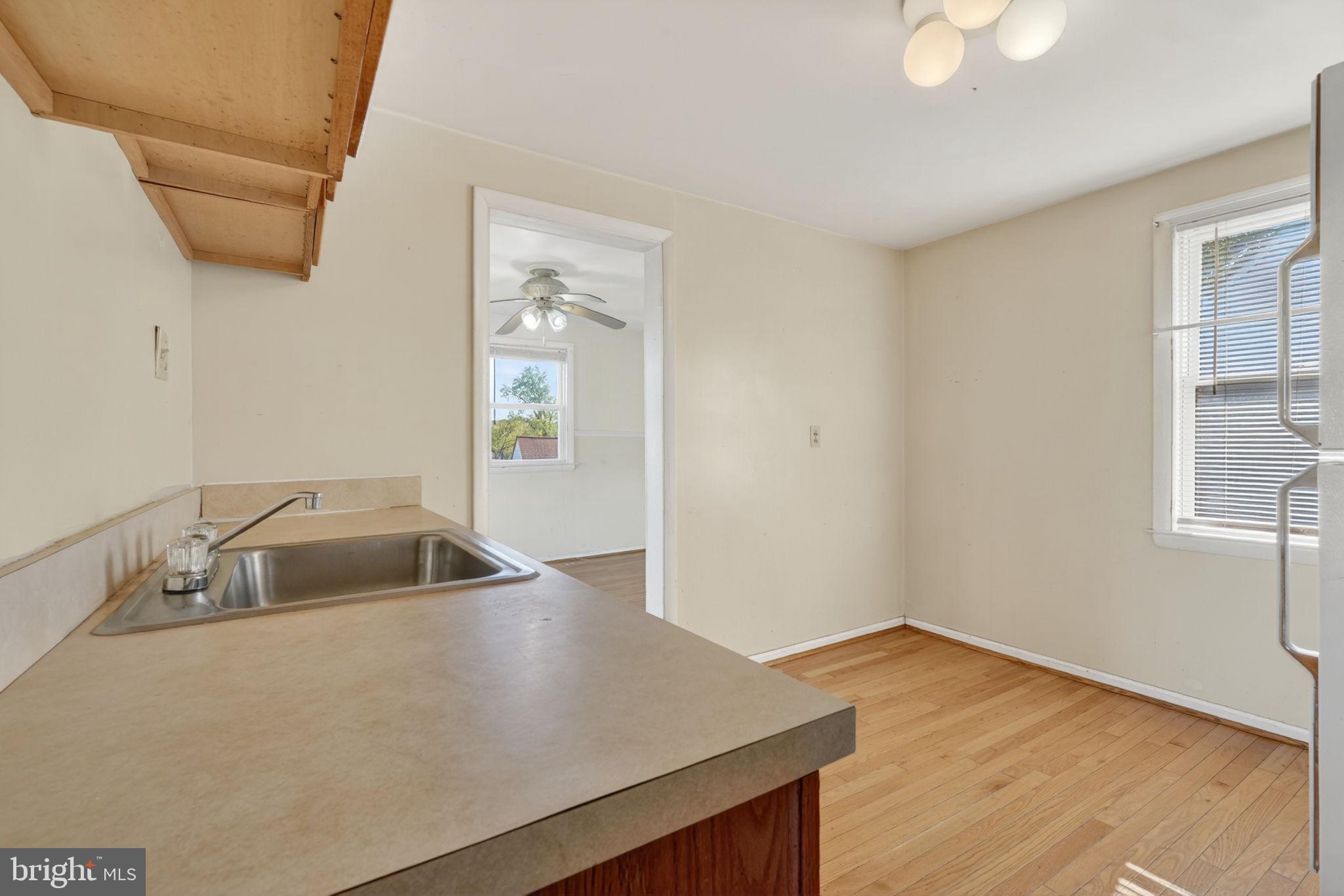 5441 Taussig Road Bladensburg, MD 20710 - Photo 9 of 37 a kitchen with sink and cabinets