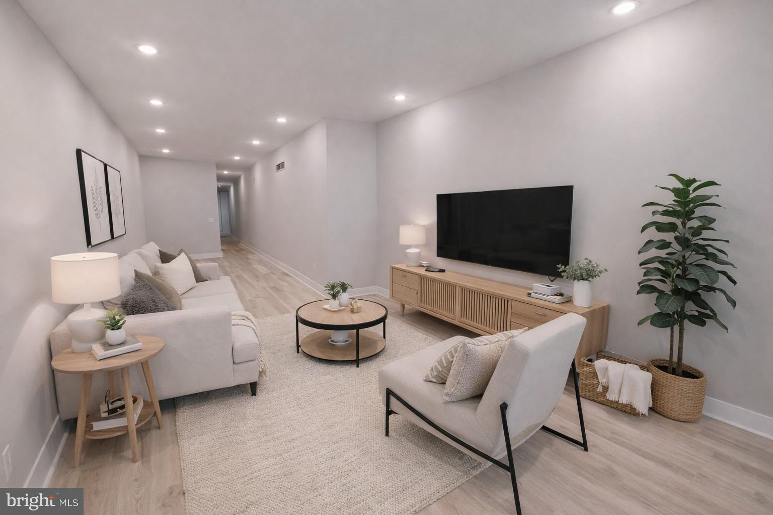 650 North 36th Street, Unit 1 Philadelphia, PA 19104 - Photo 1 of 15 a living room with furniture and a flat screen tv