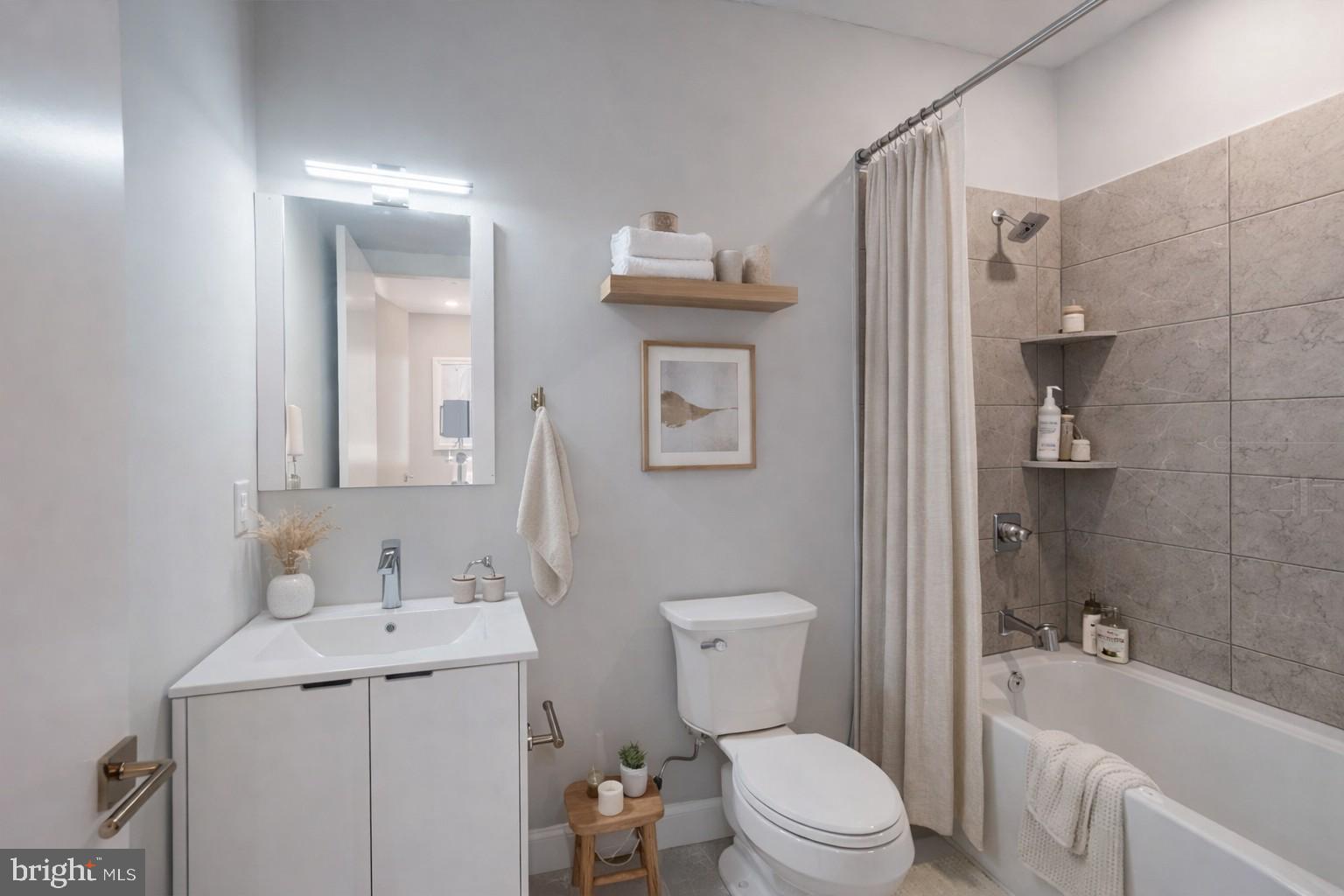 650 North 36th Street, Unit 1 Philadelphia, PA 19104 - Photo 5 of 15 a bathroom with a sink toilet and shower