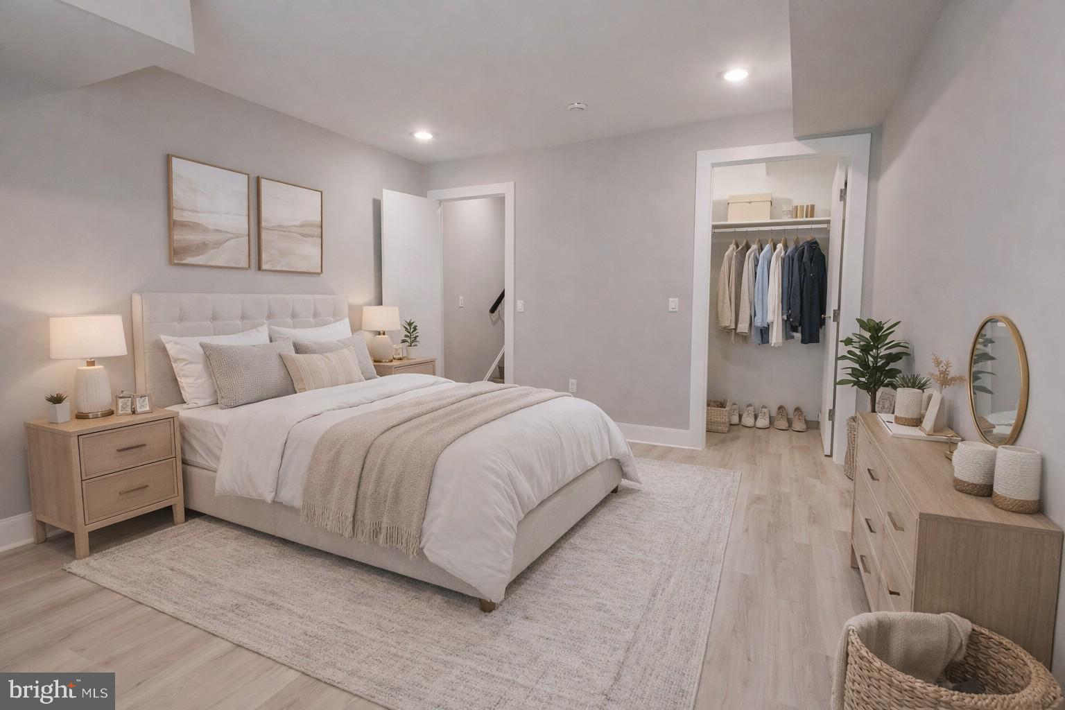650 North 36th Street, Unit 1 Philadelphia, PA 19104 - Photo 6 of 15 a spacious bedroom with a bed a mirror and potted plant