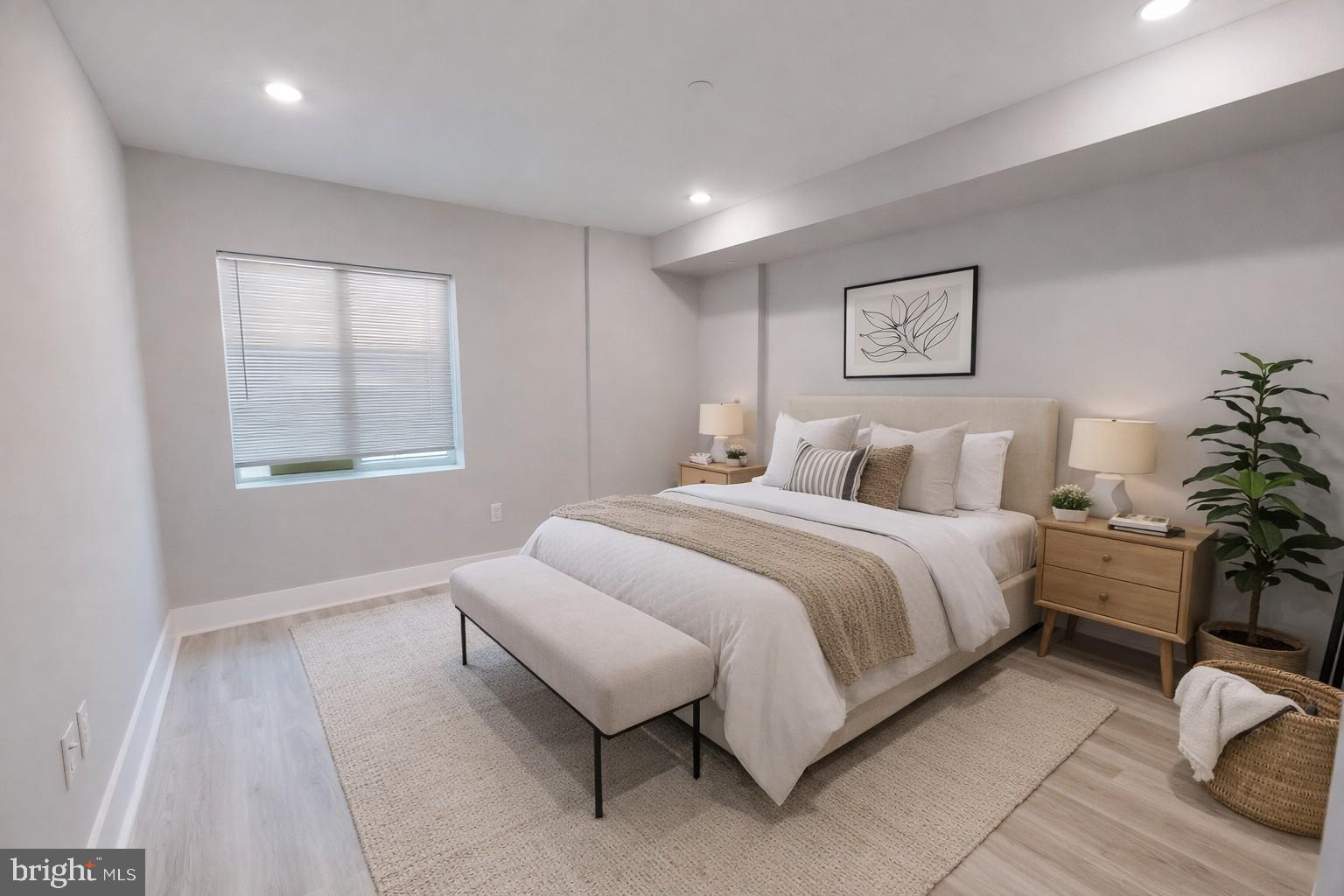 650 North 36th Street, Unit 1 Philadelphia, PA 19104 - Photo 9 of 15 a bedroom with bed and a potted plant