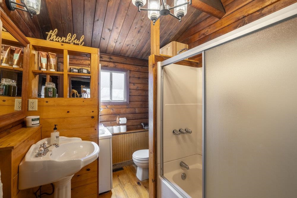 357 Wawasee Avenue Tahoe Vista, CA 96148 - Photo 18 of 28 a bathroom with a sink a toilet and shower