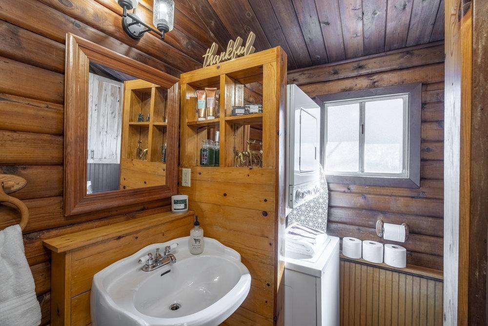 357 Wawasee Avenue Tahoe Vista, CA 96148 - Photo 19 of 28 a bathroom with a sink a toilet and shower