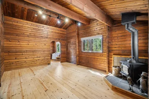 a room with wooden walls and furniture
