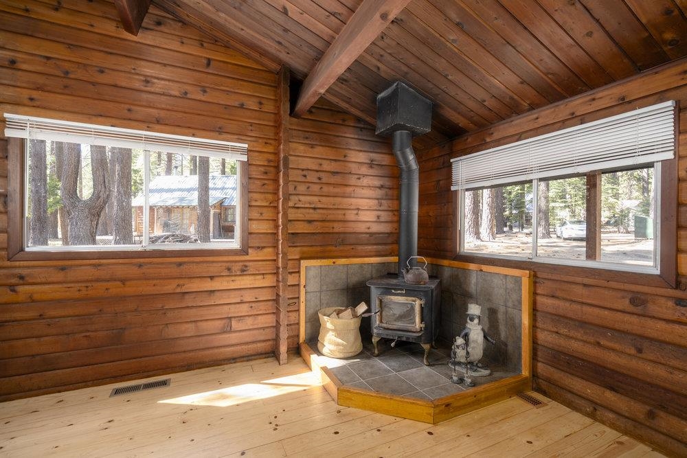 357 Wawasee Avenue Tahoe Vista, CA 96148 - Photo 8 of 28 a room with wooden walls and furniture
