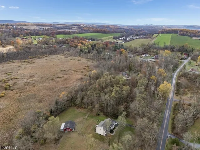 a view of a field with an ocean