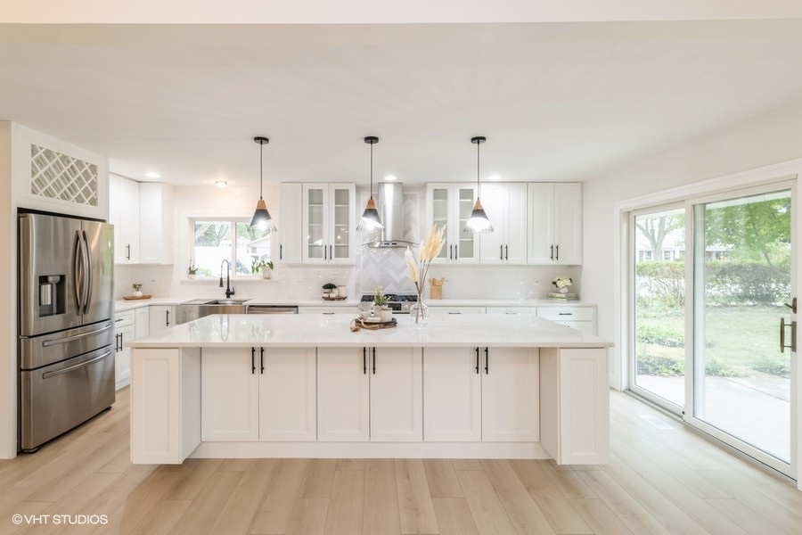 815 Downing Drive Schaumburg, IL 60169 - Photo 3 of 8 a kitchen with a sink a window and stainless steel appliances
