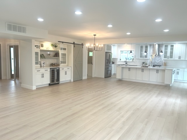 815 Downing Drive Schaumburg, IL 60169 - Photo 4 of 8 a kitchen with stainless steel appliances kitchen island wooden cabinets and granite counter tops