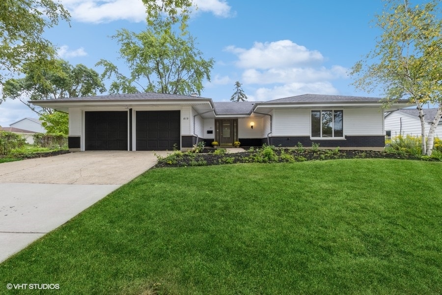 815 Downing Drive Schaumburg, IL 60169 - Photo 6 of 8 a front view of house with yard and trees
