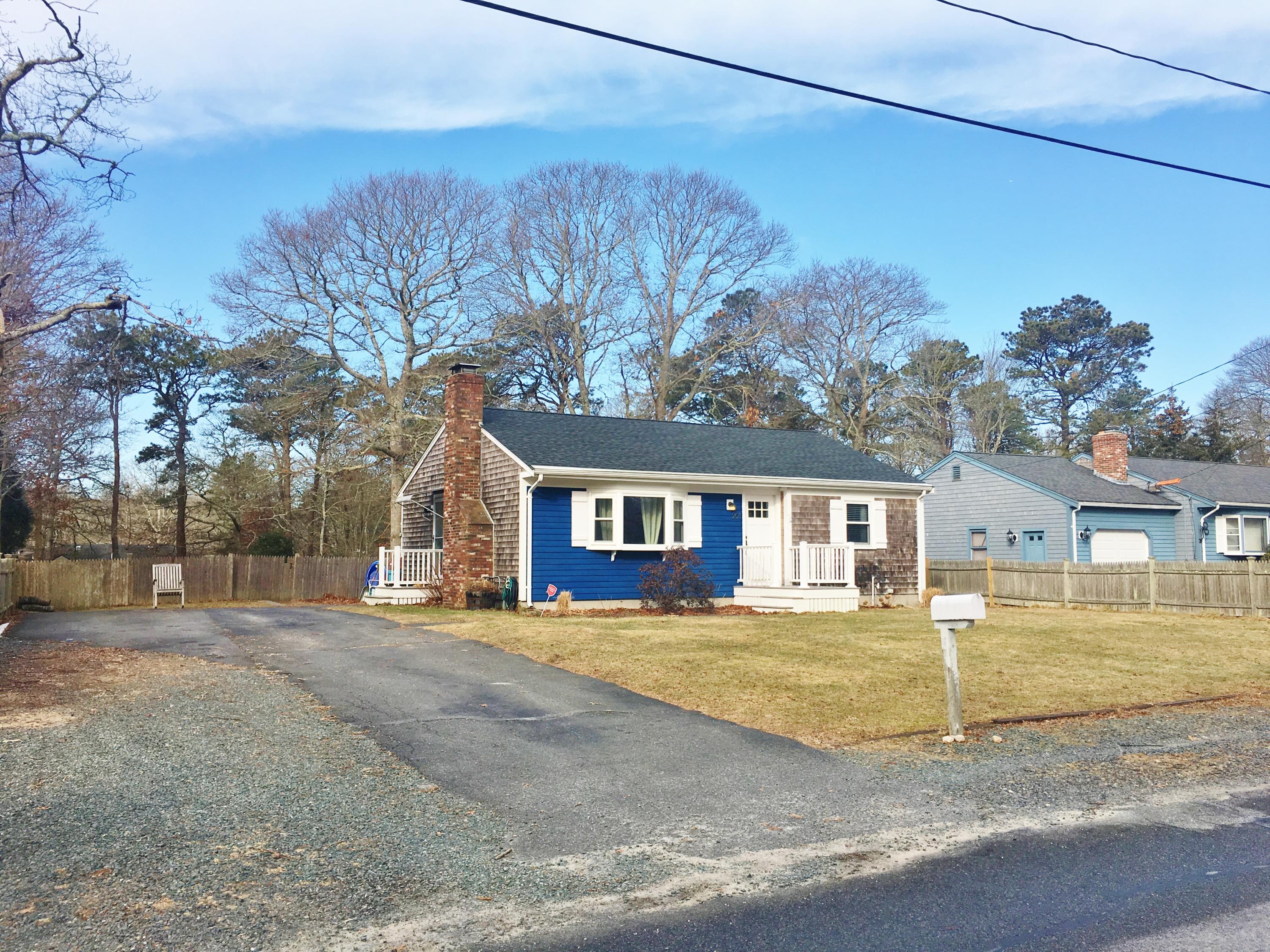 201 Megan Road Hyannis, MA 02601 - Photo 2 of 16 a house that has a tree in front of it