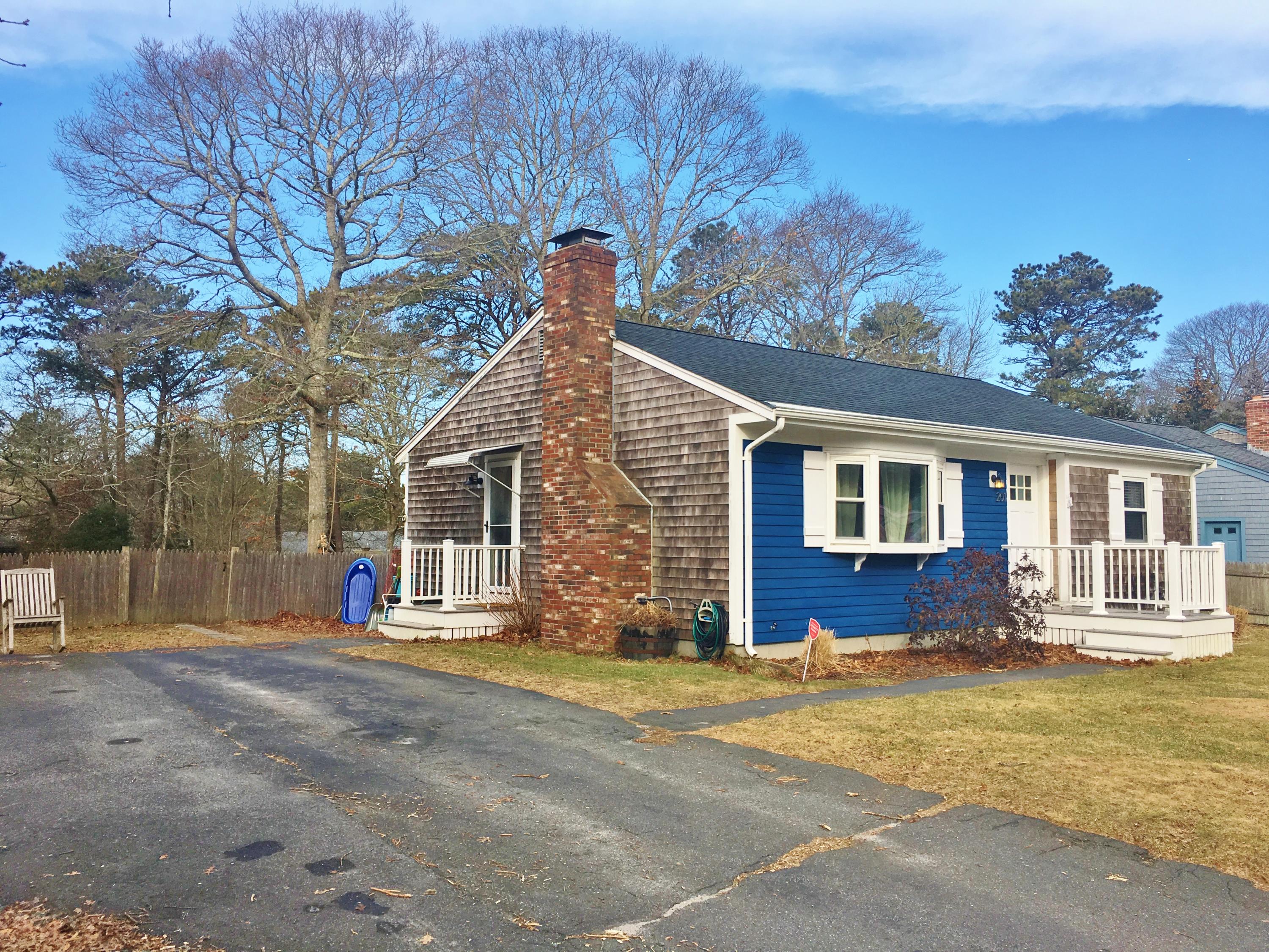 201 Megan Road Hyannis, MA 02601 - Photo 3 of 16 a front view of a house with a garage