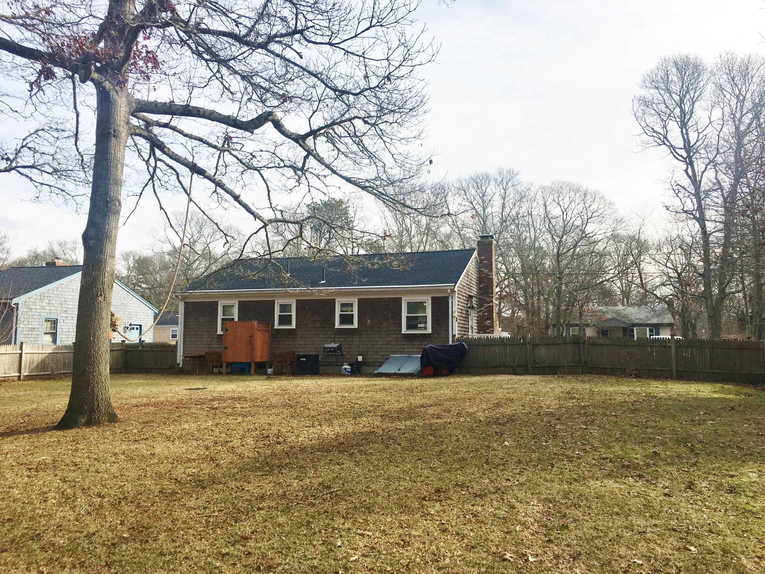 201 Megan Road Hyannis, MA 02601 - Photo 4 of 16 a front view of house with yard and trees