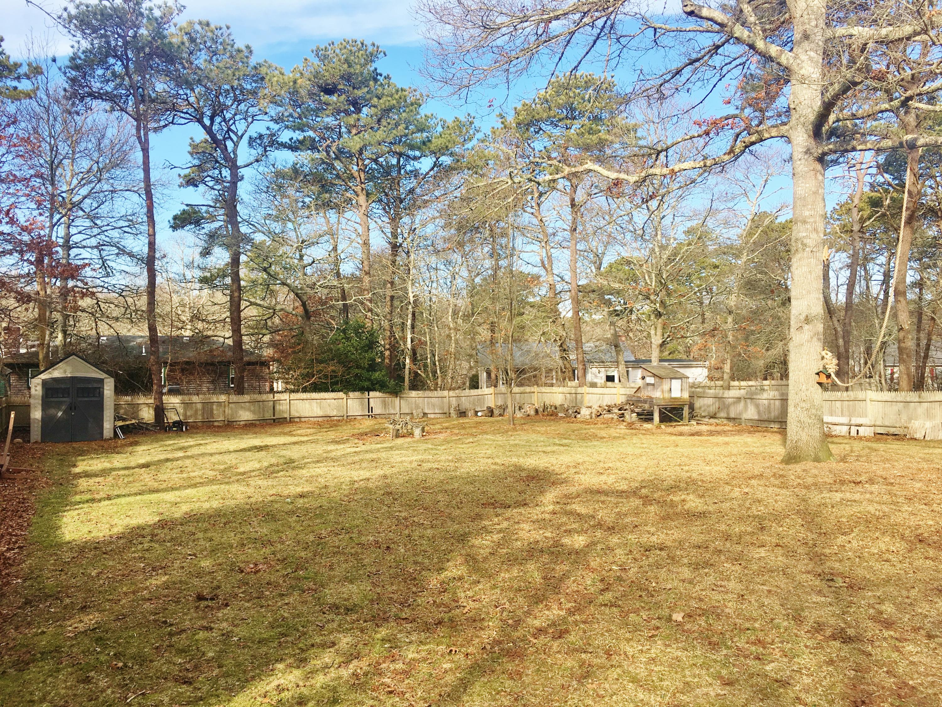 201 Megan Road Hyannis, MA 02601 - Photo 5 of 16 a view of yard with large trees
