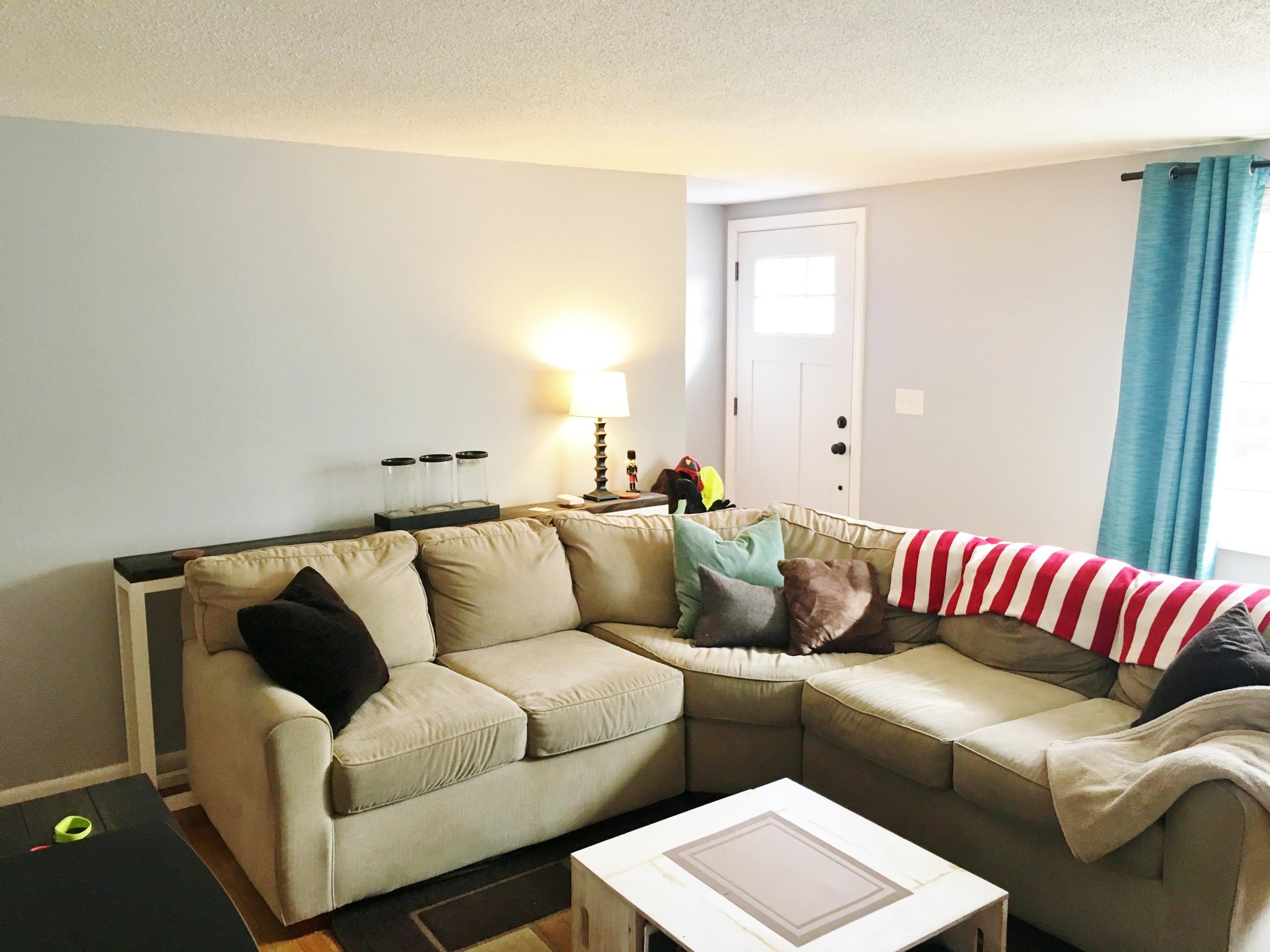 201 Megan Road Hyannis, MA 02601 - Photo 7 of 16 a living room with a couch and a potted plant