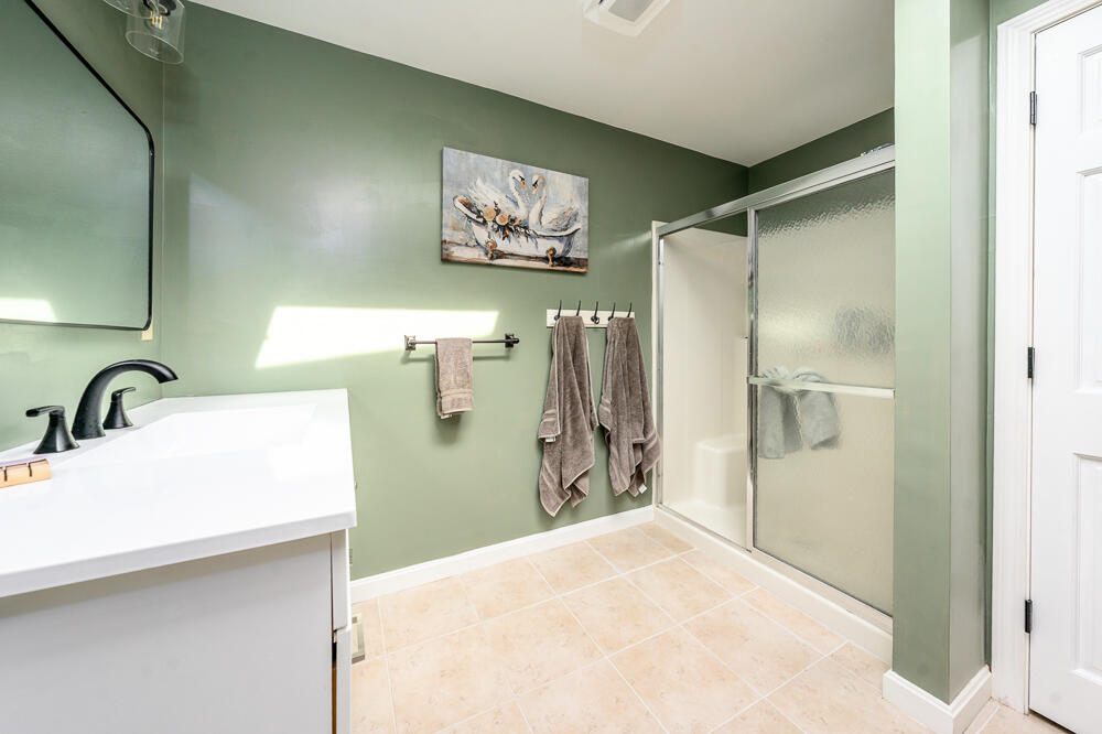 165 Concord Lane Osterville, MA 02655 - Photo 22 of 56 a bathroom with a sink and a mirror