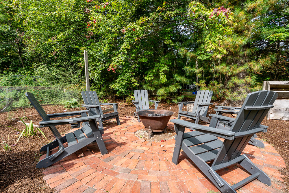 165 Concord Lane Osterville, MA 02655 - Photo 44 of 56 a view of a patio with table and chairs and couches