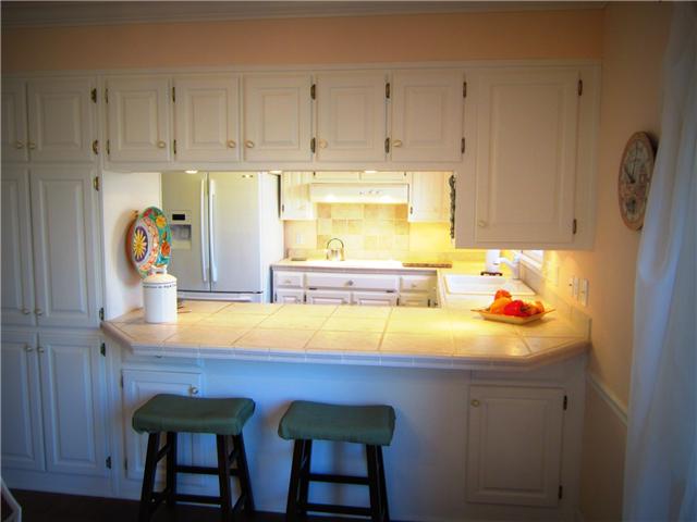 318 Stoneybrook Road Columbia, TN 38401 - Photo 6 of 20 Kitchen with raised tile countertops and an abundance of cabinet space.