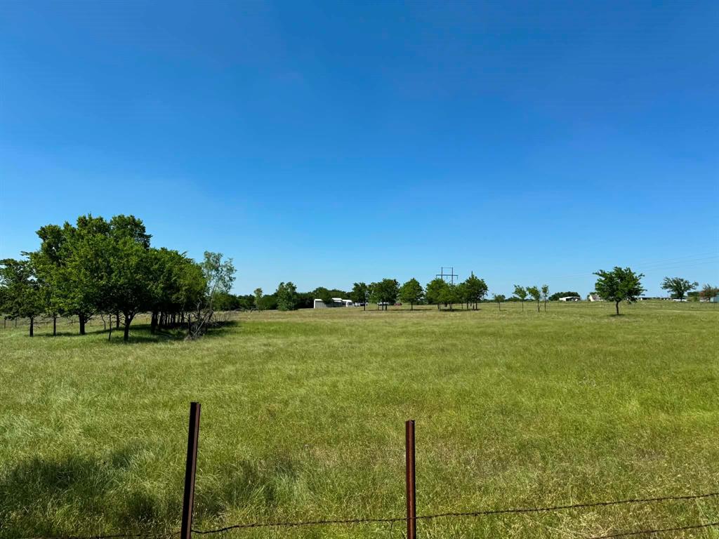 4444 Belz Road Sanger, TX 76266 - Photo 4 of 13 a view of a lake from a yard