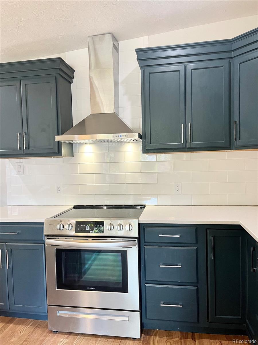 3907 Jasmine Street Colorado Springs, CO 80907 - Photo 10 of 23 a stove top oven sitting inside of a kitchen