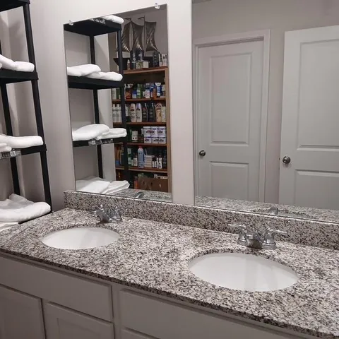 a bedroom with a bed and dresser