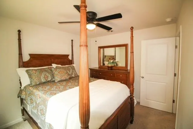 a picture of a bench in front of a wall