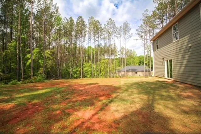 a view of a yard with a house