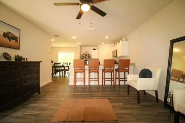 a living room with furniture and a window