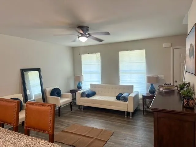 a living room with furniture and a large window