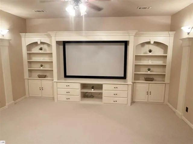 a view of cabinets and flat screen tv