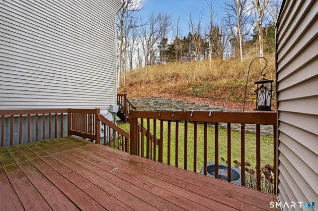 a view of balcony with wooden floor
