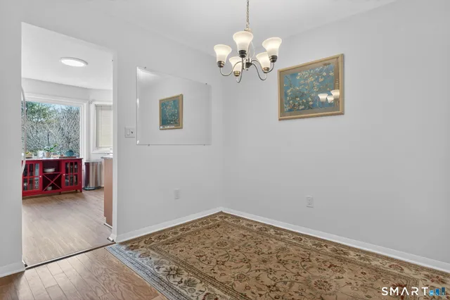 a view of a livingroom with wooden floor
