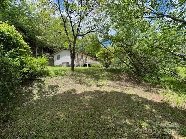 a backyard of a house with lots of green space