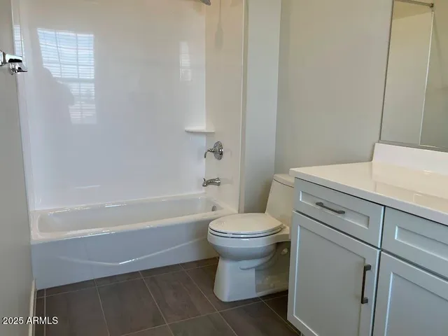 a front view of a building with sitting area