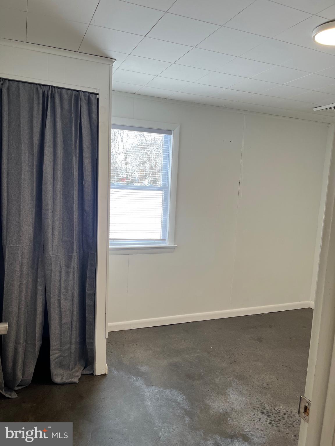 516 Little Britain Church Road Peach Bottom, PA 17563 - Photo 8 of 11 an empty room with a window