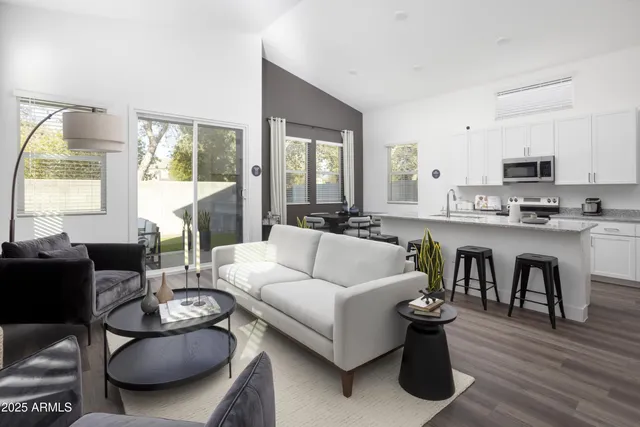 a kitchen with granite countertop a sink and a stove