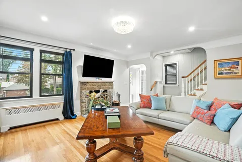 a living room with furniture fireplace and a flat screen tv