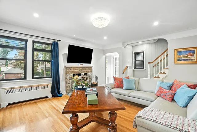 a living room with furniture fireplace and a flat screen tv