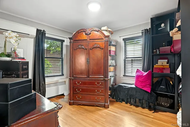 a bedroom with a bed and a television