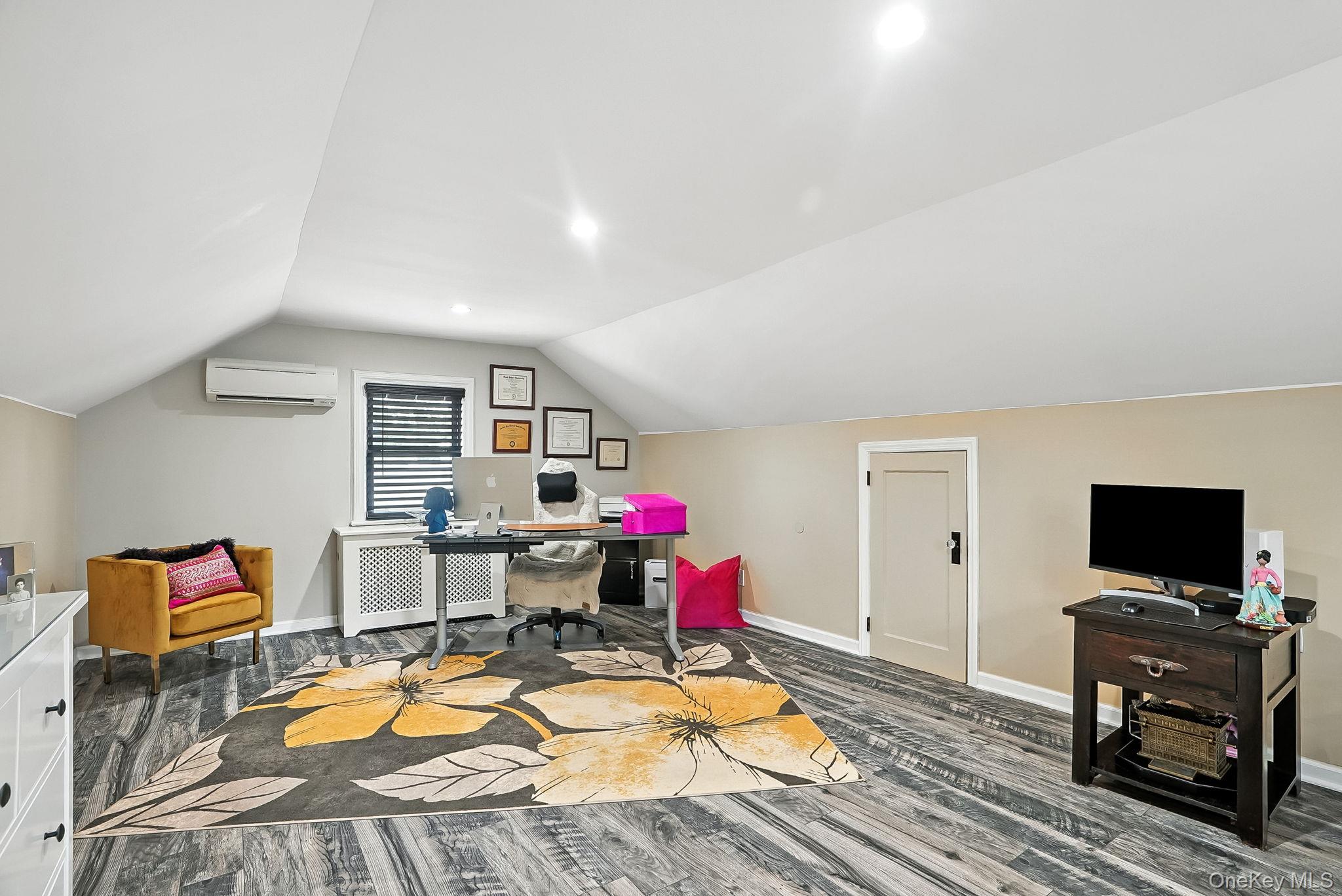 1260 Rhinelander Avenue Bronx, NY 10461 - Photo 26 of 50 Office space featuring vaulted ceiling, dark wood-type flooring, recessed lighting, and a wall mounted air conditioner