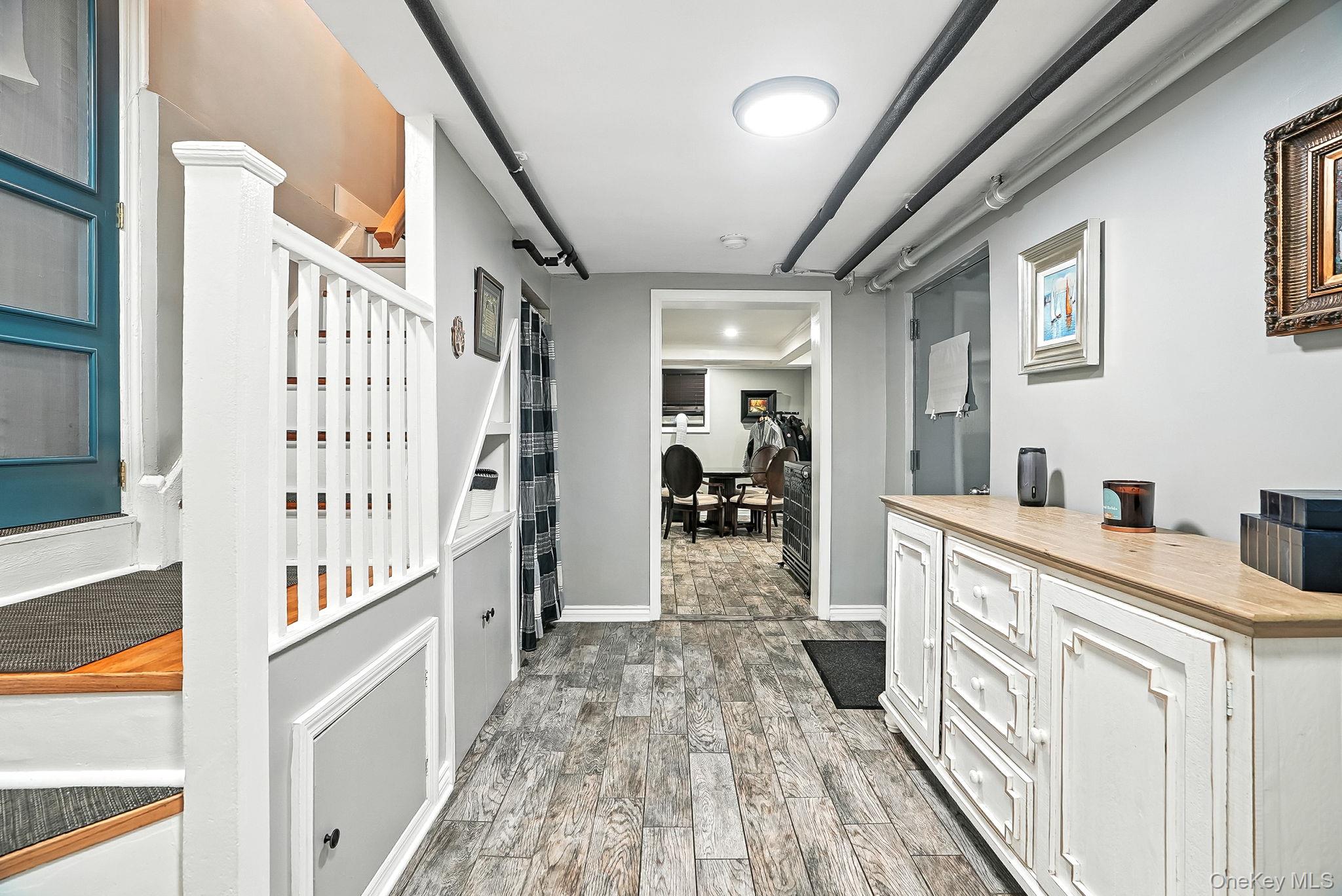 1260 Rhinelander Avenue Bronx, NY 10461 - Photo 31 of 50 Hallway with dark wood-style flooring and baseboards
