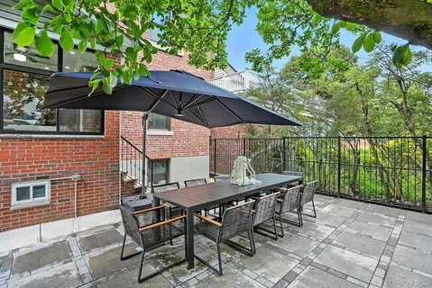 a view of backyard with seating space