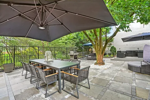 a patio with a patio table and chairs
