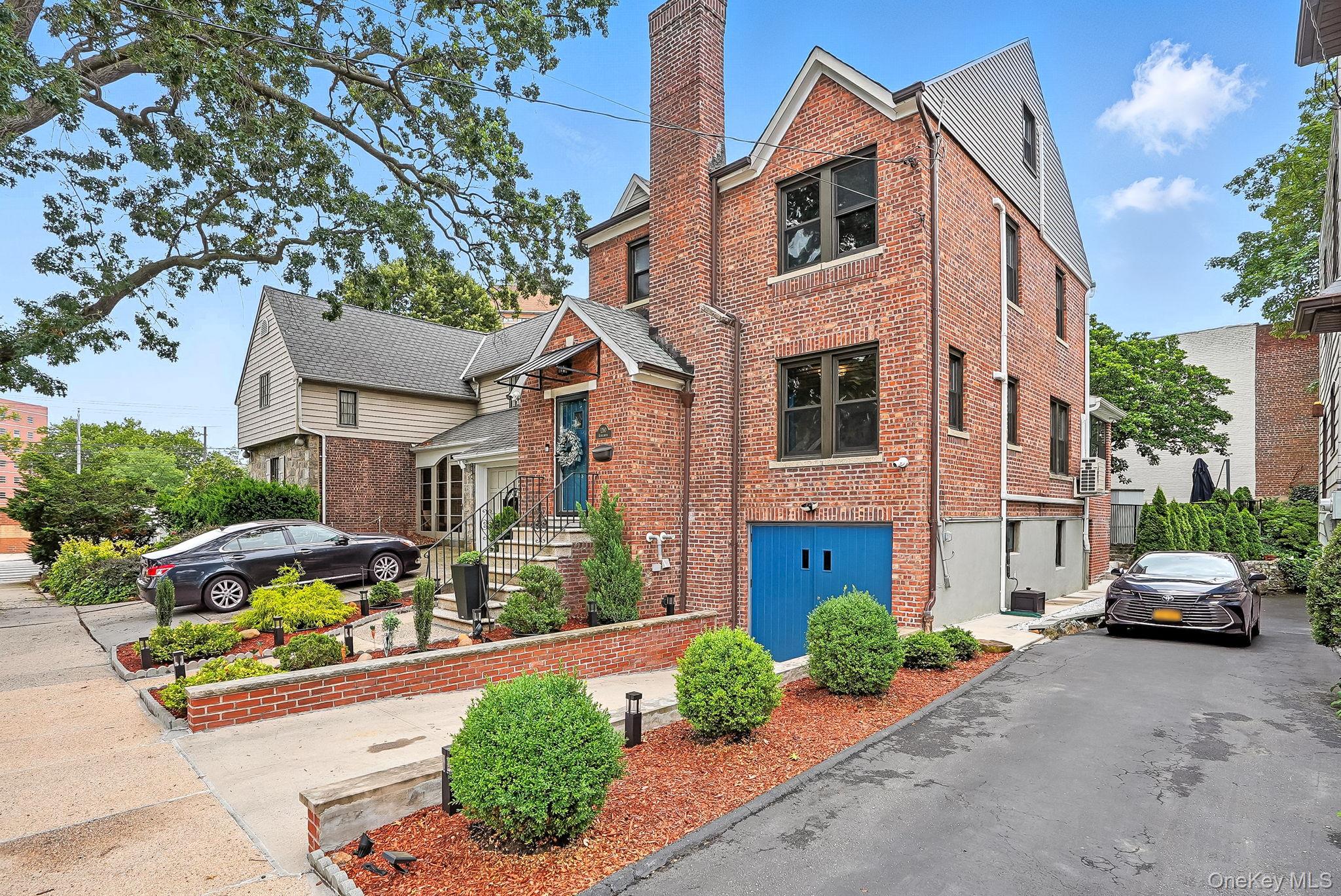 1260 Rhinelander Avenue Bronx, NY 10461 - Photo 45 of 50 View of front facade with brick siding and a chimney