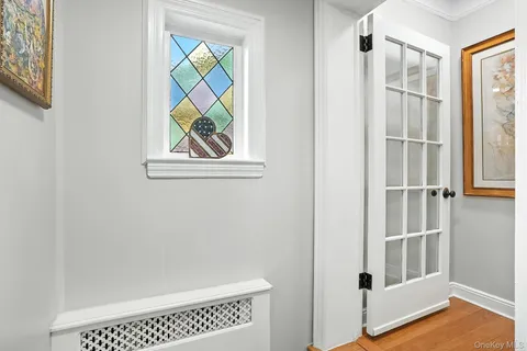 a view of an entryway with wooden floor