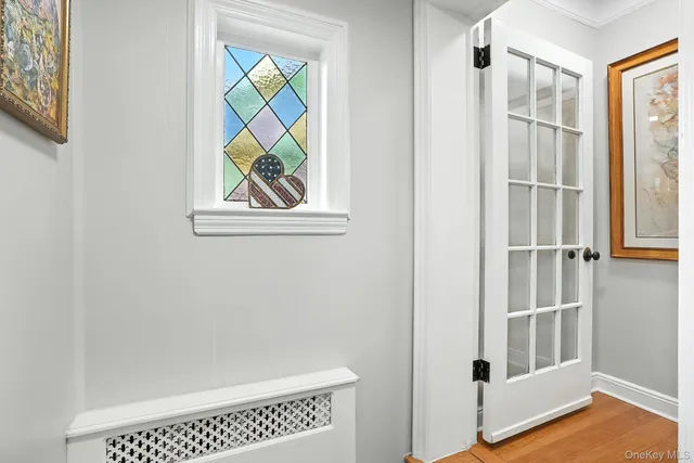 a view of an entryway with wooden floor