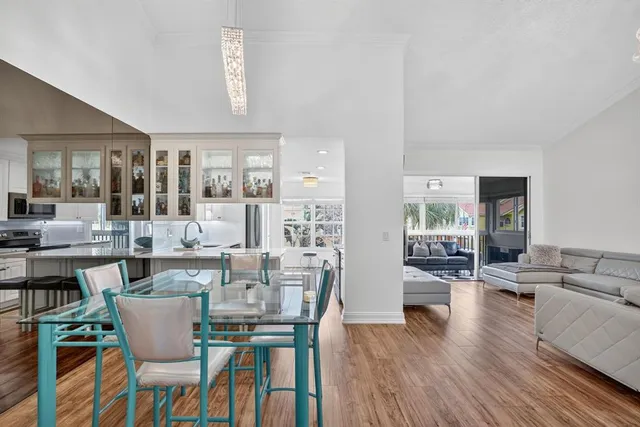 a kitchen with stainless steel appliances granite countertop a refrigerator sink and cabinets