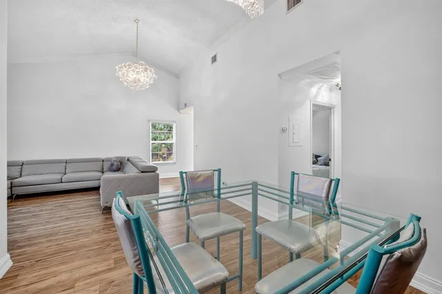a kitchen with a stove a sink and a refrigerator
