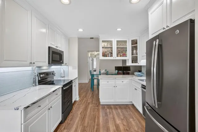 a bedroom with a bed and a chair