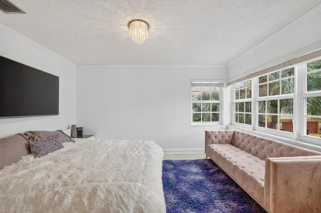 a bedroom with a bed and cabinets